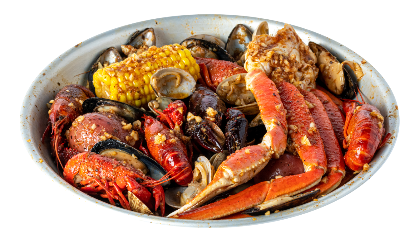 Seafood boil in a metal bowl with snow crab legs, crawfish, mussels, clams, corn on the cob and red potatoes